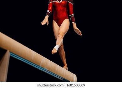 Women Balance Beam Artistic Gymnastics In Black Background