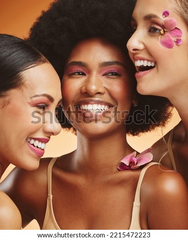 Women, beauty and flowers, makeup and diversity of models on orange studio background. Skincare, face and happy, young and elegant female group posing together with cosmetics, orchids or pink plants.