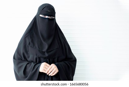 Women in black traditional muslim dresses cover the body, Muslim Arabic woman portrait wearing black hijab veil, Saudi Arabian woman portrait wearing niqab, Portrait of a woman wearing a burka, 
