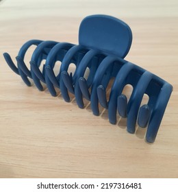 Women Blue Hairpin On A Wooden Desk