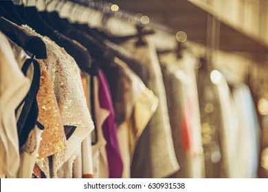 Women Boutique Shop Concept - Colorful Clothing On Hangers.