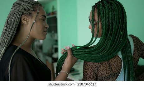 Women with box braid hairstyle. Two African American girls with braided hair