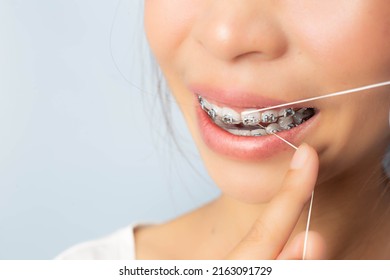 Women With Braces Flossing Teeth Clean Teeth Morning Routine Prevention Of Gingivitis Concept Of Dental Care And Oral Hygiene