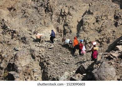 Women Bring Their Food And Drink Needs Through Rugged Mountain Roads Because Of  Al-Houthi Militia Siege Of The Villages Of Jabal Habashi District In The  West Of Taiz City,Yemen.