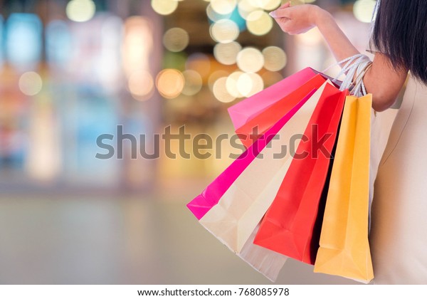 Women Carrying Colorful Shopping Bags Blurred Stock Photo (Edit Now) 768085978