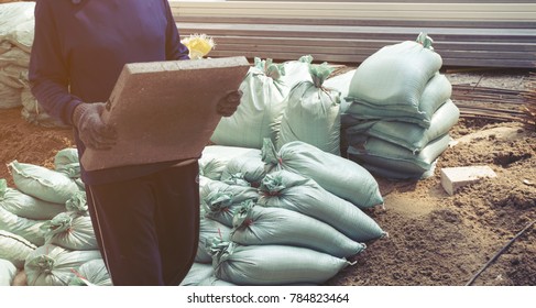 Women Carrying Sandbags