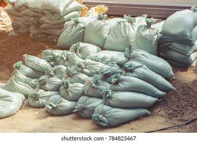 Women Carrying Sandbags