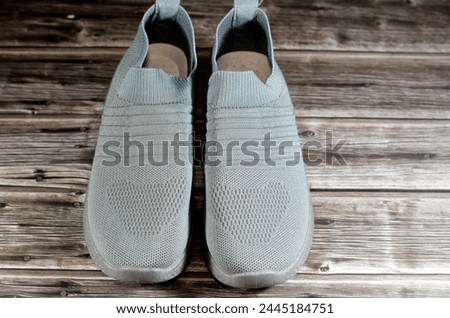 Women casual grey shoes, a shoe is an item of footwear intended to protect and comfort the human foot, shoes provide protection, it has different designs and shapes, selective focus