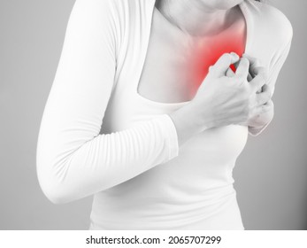 
Women Clutch Chest Heart Attack Symptom. Pain From Heart Stroke Healthcare And Medical Concept.