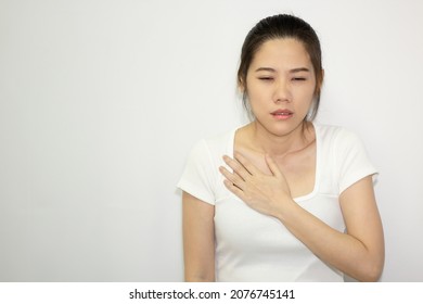 Women Clutch Chest Heart Attack Symptom. Pain From Heart Stroke Healthcare And Medical Concept.