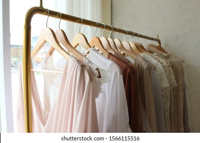 Women Colorful Spring Dress Clothes Are Set On A Shelf In A Clothing Store.