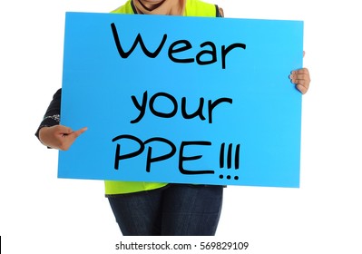 Women Construction Workers Pointing To The Wear Your PPE Word.