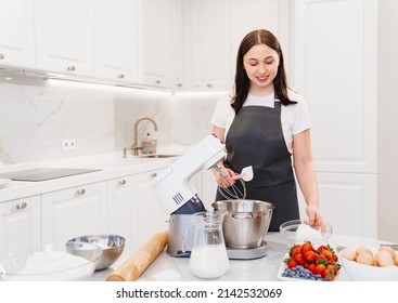 A Women Cook Adds A Cottage Cheese Cream To Prepare Dough Or Cream In A Mixer Bowl. Cooking Courses. Bread And Dessert Recipes. Family Business. Online Lessons For Cooks.