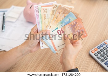 women counting euro money banknote. concept of home finance, personal loan,insurance claim.