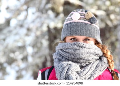 Women Covering Her Face With Scarf To Keep Warm