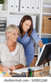 Women From Different Generations Working Together In An Office.