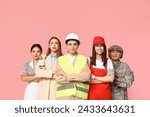 Women of different professions on pink background