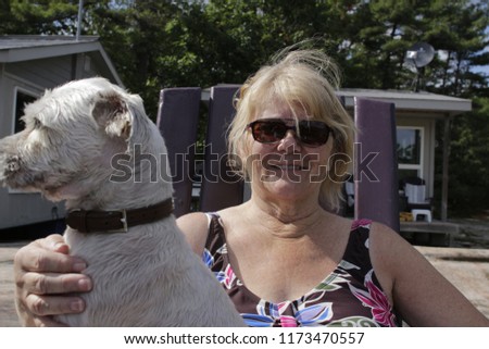 women with dog on lap