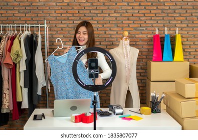 Women Doing Business Selling Online. Selling Clothes By Live Broadcasting Through Internet Channels. Online Shopping Via Credit Card.