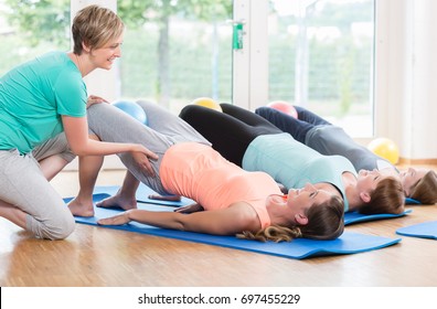 Women Doing Exercises For Pelvis Floor In Postnatal Regression Course