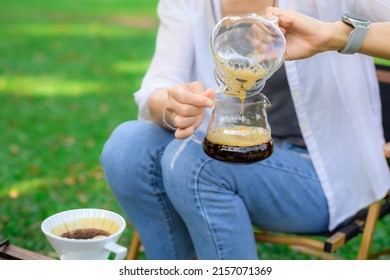 Women Drift Good Coffee In The Garden Outdoor.