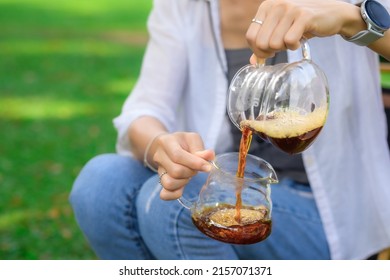 Women Drift Good Coffee In The Garden Outdoor.