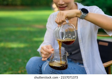 Women Drift Good Coffee In The Garden Outdoor.