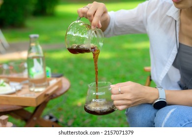 Women Drift Good Coffee In The Garden Outdoor.