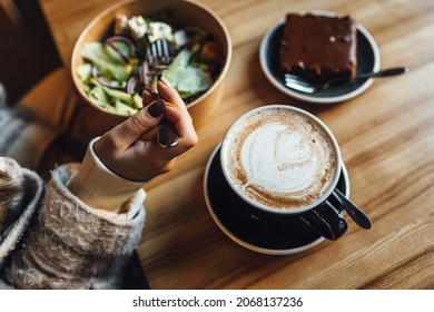 Women Drinking Chai Latte At Coffee Shop, Seasonal Coffee Drinks With Latter Art.