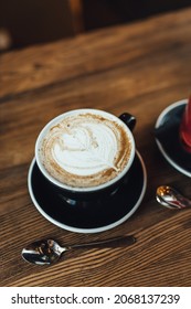 Women Drinking Chai Latte At Coffee Shop, Seasonal Coffee Drinks With Latter Art.