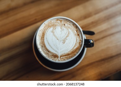 Women Drinking Chai Latte At Coffee Shop, Seasonal Coffee Drinks With Latter Art.