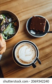 Women Drinking Chai Latte At Coffee Shop, Seasonal Coffee Drinks With Latter Art.