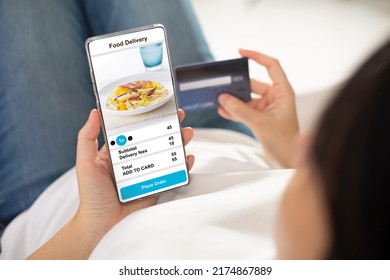 Women During Confirm Food Delivery Online Order Using Mobile Phone Smartphone At Home. Person Using Smartphone Order Food From Restaurant To Home Front Door. Concept