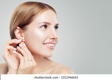 Women Earring Jewelry Model. Cheerful Woman With Diamond Earrings And Ring, Beautiful Face Closeup