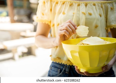 Women Eat Potato Snack