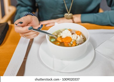 Women Eating Chicken Soup Close Up