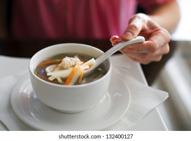 Women Eating Chinese Chicken Soup Close Up