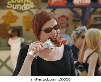 Women Eating A Turkey Leg