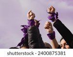 women empowerment : strong women defending rights on 8 march demonstration. Purple colours