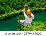 Women Enjoying a Thrilling Zipline Experience, Embracing the Exhilaration of Activity-filled Vacation and Stunning Tourism Views