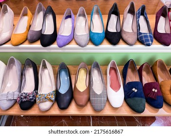 Women Fashion Shoes In The Retail Clothing Shop Display Shelf.

