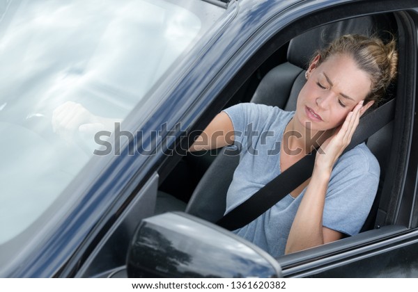 women feeling sick in\
car