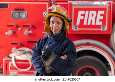 Women Firefighters Wearing Fire Fighter Suit Show Trump Up And Stand In Front Of Fire Truck Background