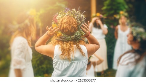 Women in flower wreath on sunny meadow, Floral crown, symbol of summer solstice - Powered by Shutterstock