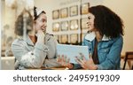 Women, friends and smile at cafe on tablet with goods news or email notification for job interview. People, sisterhood and happy or excited on website or online post for rewards and bonus on date