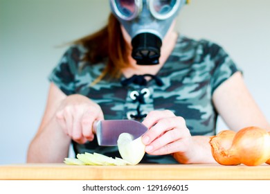 Women With Gas Mask Cuts A Onion