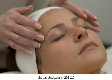  women getting a fase massage -- spa treatment