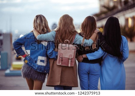 women girlfriends walk around the city