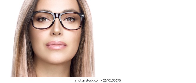 Women Glasses And Clear Vision Concept. Close Up Of Attractive Woman Face Staring At Camera With Confidence. Panorama Banner Isolated On White.