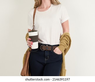women gold sweater t-shirt coffee mockup front short sleeve with beautiful background. Ready to replace your design